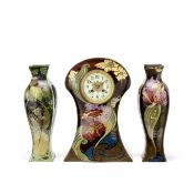 Rozenburg Mantel clock and two vases, 1903-1908