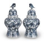 A pair of blue and white Delft vases and covers 19th century