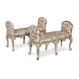 A pair of French carved beech and later limed window seats Late 19th century in the Rococo style (2)
