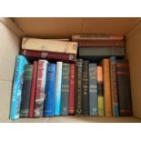 A Box of books which includes titles Trust me by John Updike, You Can't go home again by Wolfe,