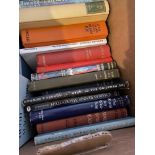 Two boxes of various books which include various Paul Theroux novels, Eric Linklater and John