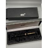 A Mont Blanc Fountain Pen designed with a 14K Gold nib, Comes with original box.