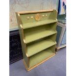 A Unique hand painted four tier bookcase. Designed with raised relief cherub and star plaques. [