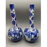 A Pair of Chinese 20th century blue and white long neck vases. [