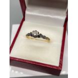 A Ladies 18ct gold and single diamond ring. [Ring size R]