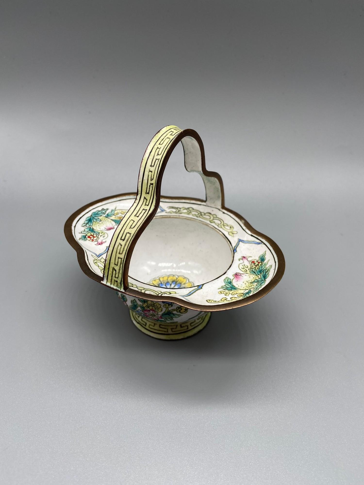 A 19th century Chinese hand painted enamel on copper basket. Designed with various foliage and