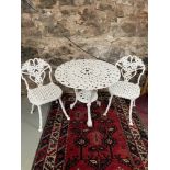 Antique white painted metal garden table and two matching chairs.