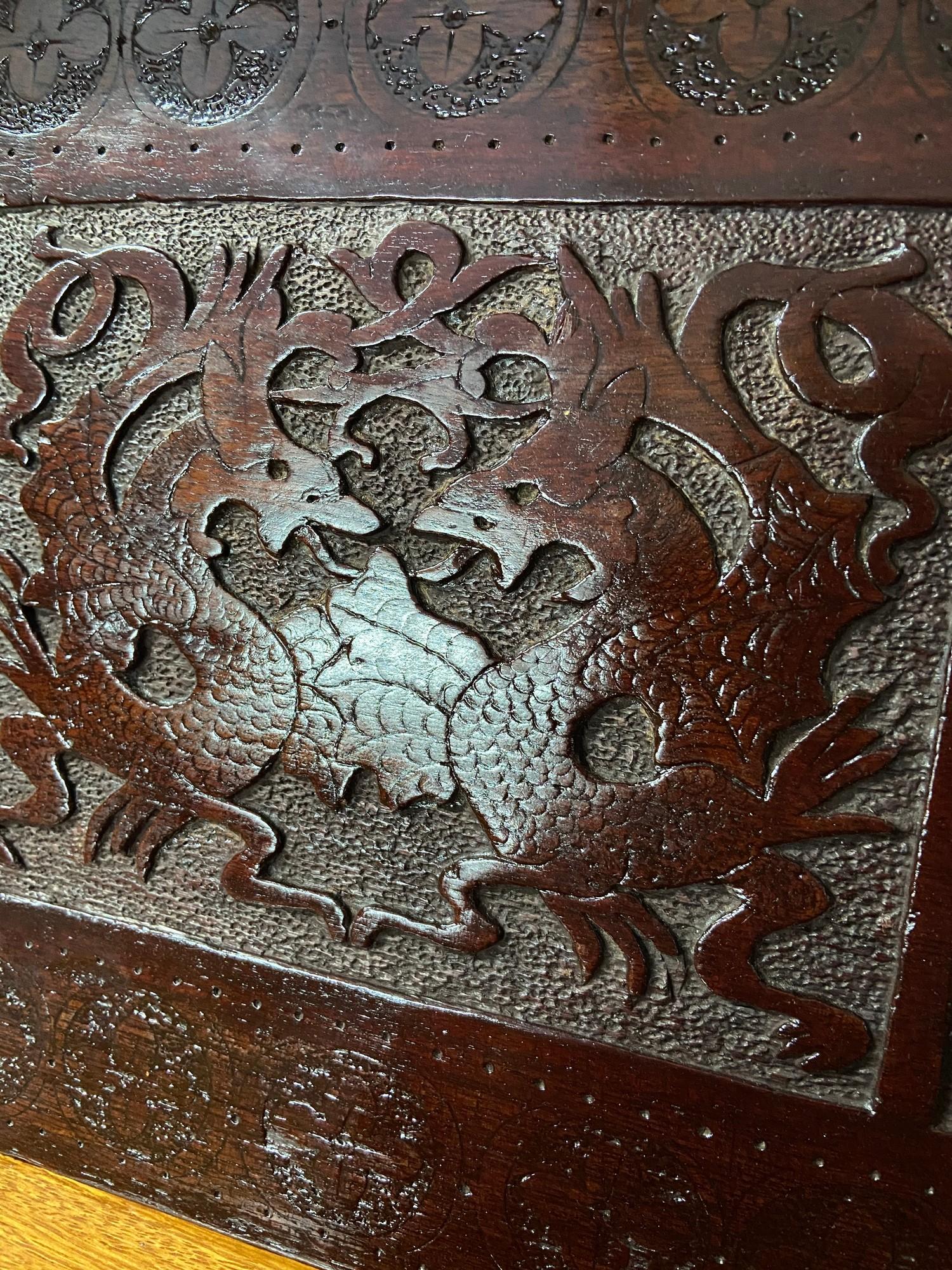 An Arts and crafts hand carved panel depicting Celtic trims and Dragons. [ - Image 3 of 4