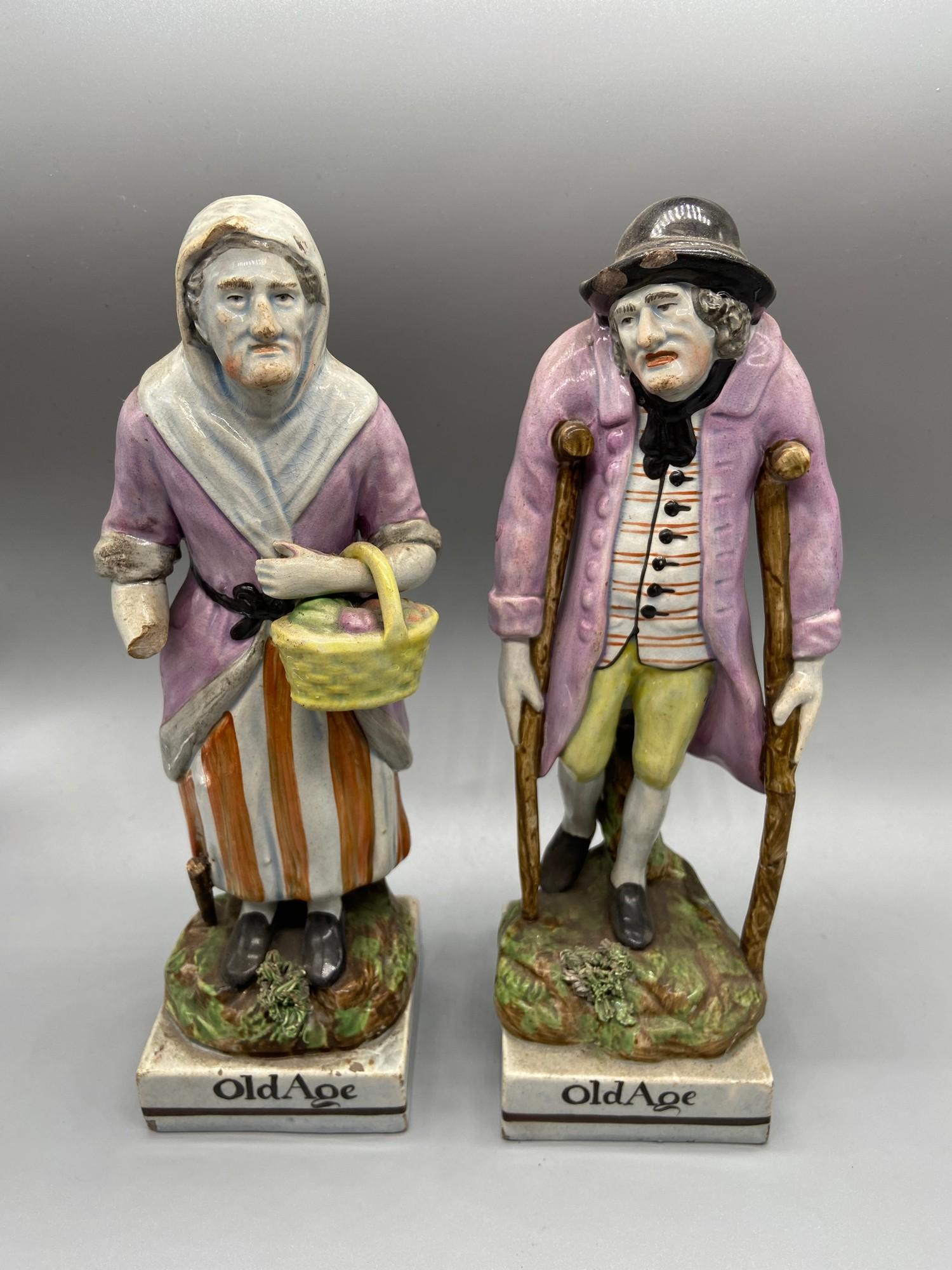 A Pair of Staffordshire Pearl Ware Old Age figurines. [As Found]