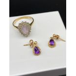 A 9ct gold ladies ring set with a pale purple tear drop stone surrounded by clear stones, Together