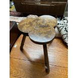 An arts and crafts milking stool