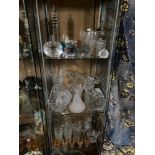 Three shelves of art glass and crystal to include Royal Mint paperweight, Glass animals, Cut crystal