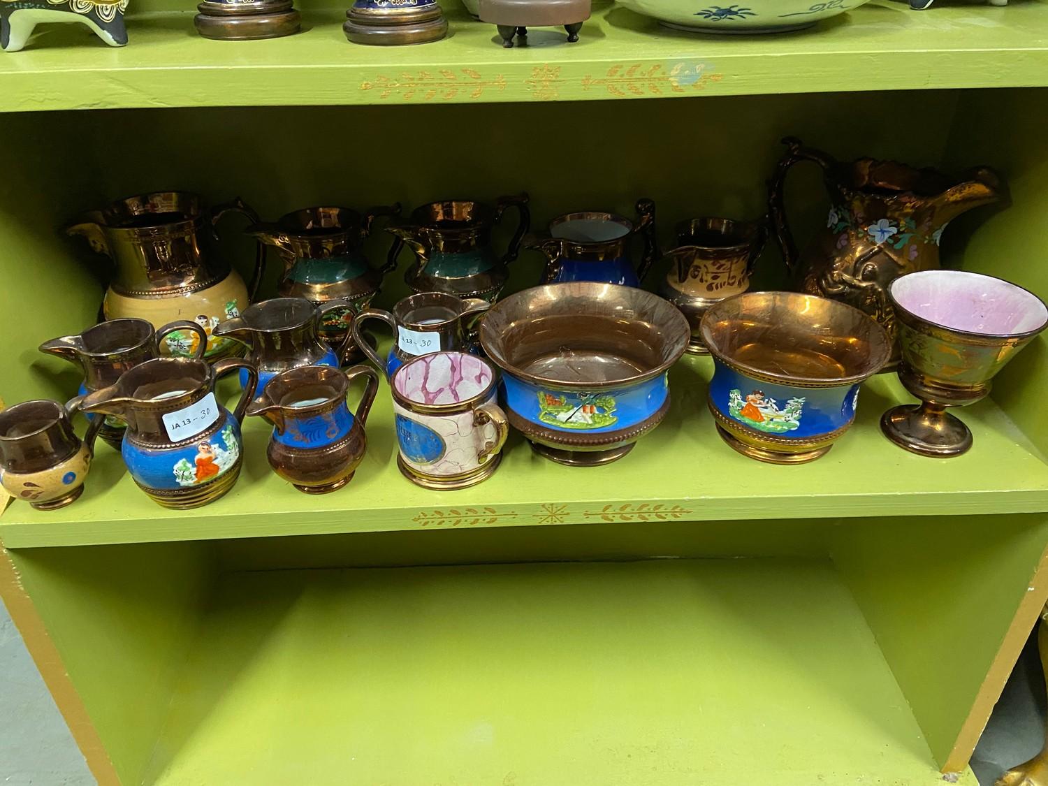 A Large quantity of Victorian lustre water jugs, creams and sugar bowls.