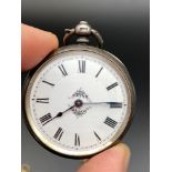 A Birmingham silver cased pocket watch designed with an enamel face. Comes with two keys. [Spring