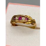 A Ladies 18ct gold diamond and pink stone ring. [Ring size J]