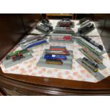 A Quantity of N Gauge train models on display stands.