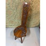 Antique Arts and Crafts hand carved spinning wheel chair.