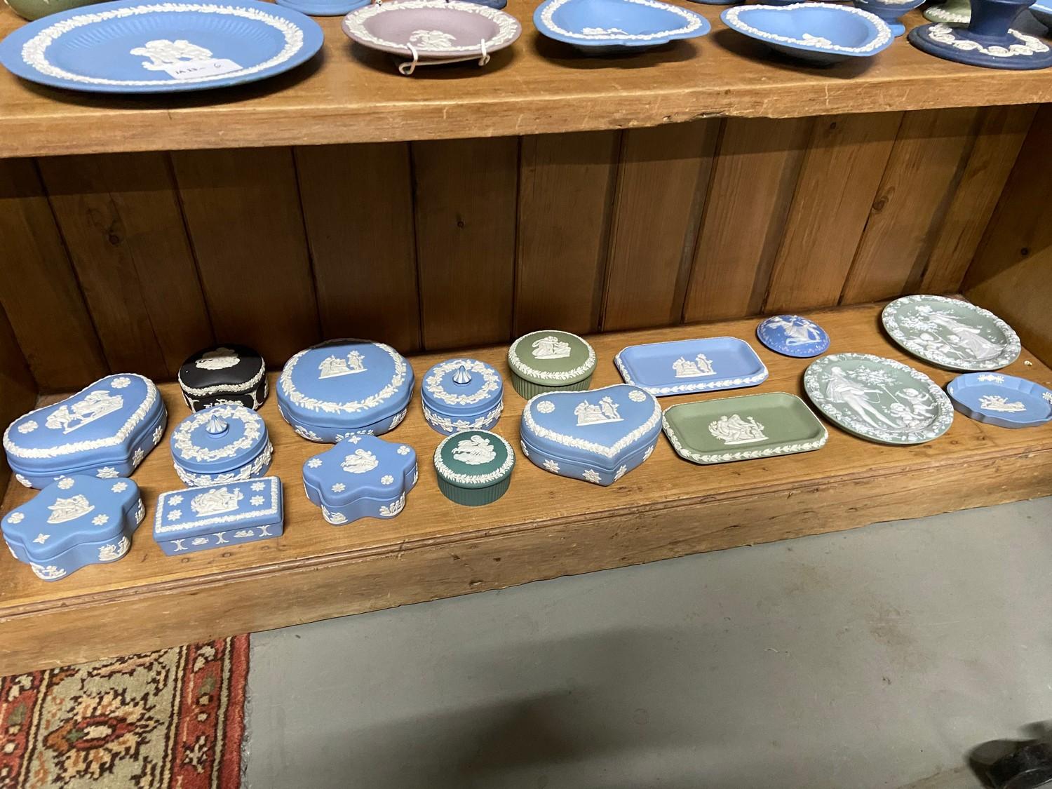 A Shelf of Wedgwood Jasper ware trinket boxes and pin dishes.