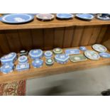A Shelf of Wedgwood Jasper ware trinket boxes and pin dishes.