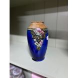 A Royal Doulton stoneware plum design vase. Signed JH To the base. [