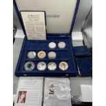 A Westminster Mint 'The Millennium' coin collection [4 coins] with a fitted case and certificates.