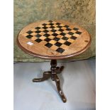 A Victorian pedestal table. Designed with an inlaid chess board.