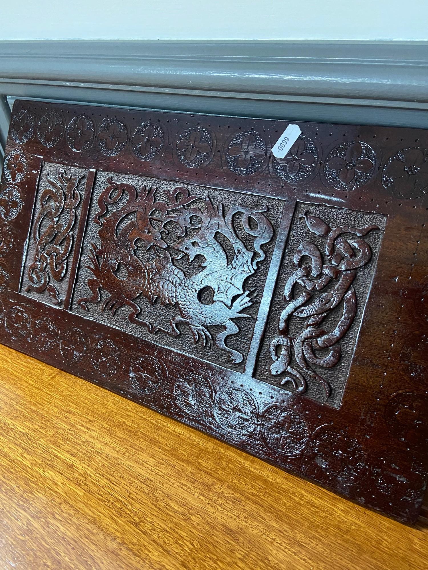 An Arts and crafts hand carved panel depicting Celtic trims and Dragons. [ - Image 2 of 4