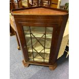 A Victorian/ Edwardian mahogany corner cabinet.