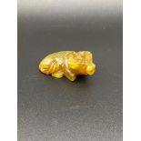 A Chinese hand carved jade ox sculpture. [5cm in length]