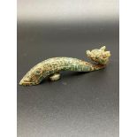 A 19th century Chinese hand carved jade belt buckle. Carved in the form of a dragon. [Measures