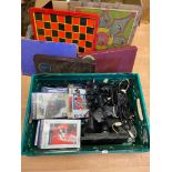 A Crate containing Slimline PS2 Console, controllers, games and various vintage board games