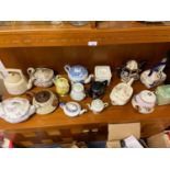 A Selection of porcelain tea pots to include various Victorian tea pots