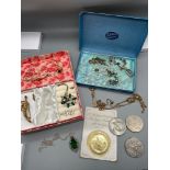 A Selection of various vintage costume Jewellery and coins which includes necklaces and various