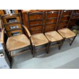 A Lot of three 19th century ladder back dining chairs and matching carver chair.