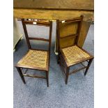 Two antique bedroom chairs with rattan bases