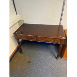 Antique Two drawer writing desk. Designed with turned leg supports.