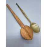 Two Antique porridge spoons. One made from bone with silver thistle mount. The other is carved