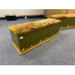 A charming antique hand painted linen chest with material top. Brass handles to the side and a