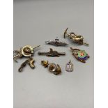 A quantity of various badges which includes RAF sweetheart brooch, Two Hiking badges and Naval