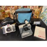 A Vintage Polaroid Land Camera 'The Button' comes with flash and carry bag. Together with a