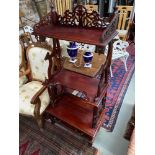 Antique style three tier ornate shelving unit. Designed with a single drawer.