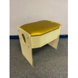 A Vintage lift top dressing table stool.