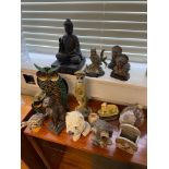 A Quantity of various animal figurines which includes Egyptian cat figure, Meercat officer figure,