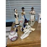 A Selection of various Russian pottery porcelain figurines and vodka fish decanter and shot glasses.