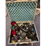 A Camera hard case contain various cameras and lenses. Topcon IC-I Auto.