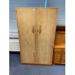 A Solid lime wash design antique two door wardrobe. Fitted with interior drawers and mirror. Comes