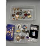 A Quantity of various pin badges which include W.V.S. Civil Defence badge and fob medal.