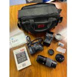 Minolta 7000 Camera with lenses and carry case.