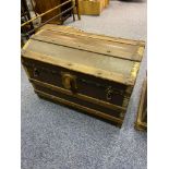 Antique Saratoga trunk designed with wood and metal bounds.