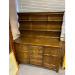 An Ercol elm wood dresser.